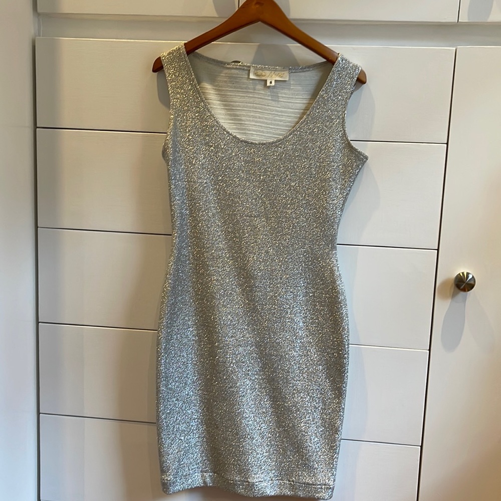 Silver, body-hugging vintage sheath. Very flattering for a slim,curvy body.